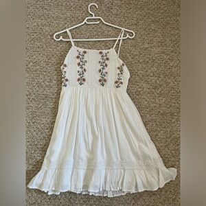 Mini white linen dress with embroidered flowers